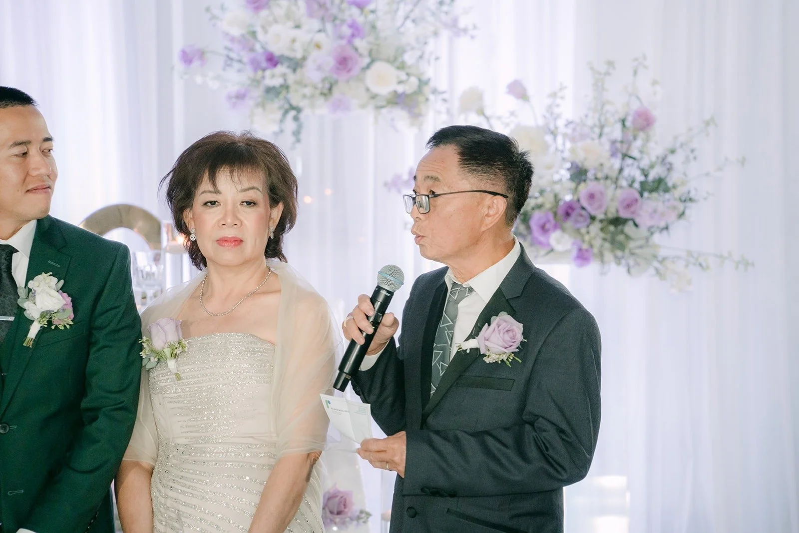 A family member gives a speech beside Kevin