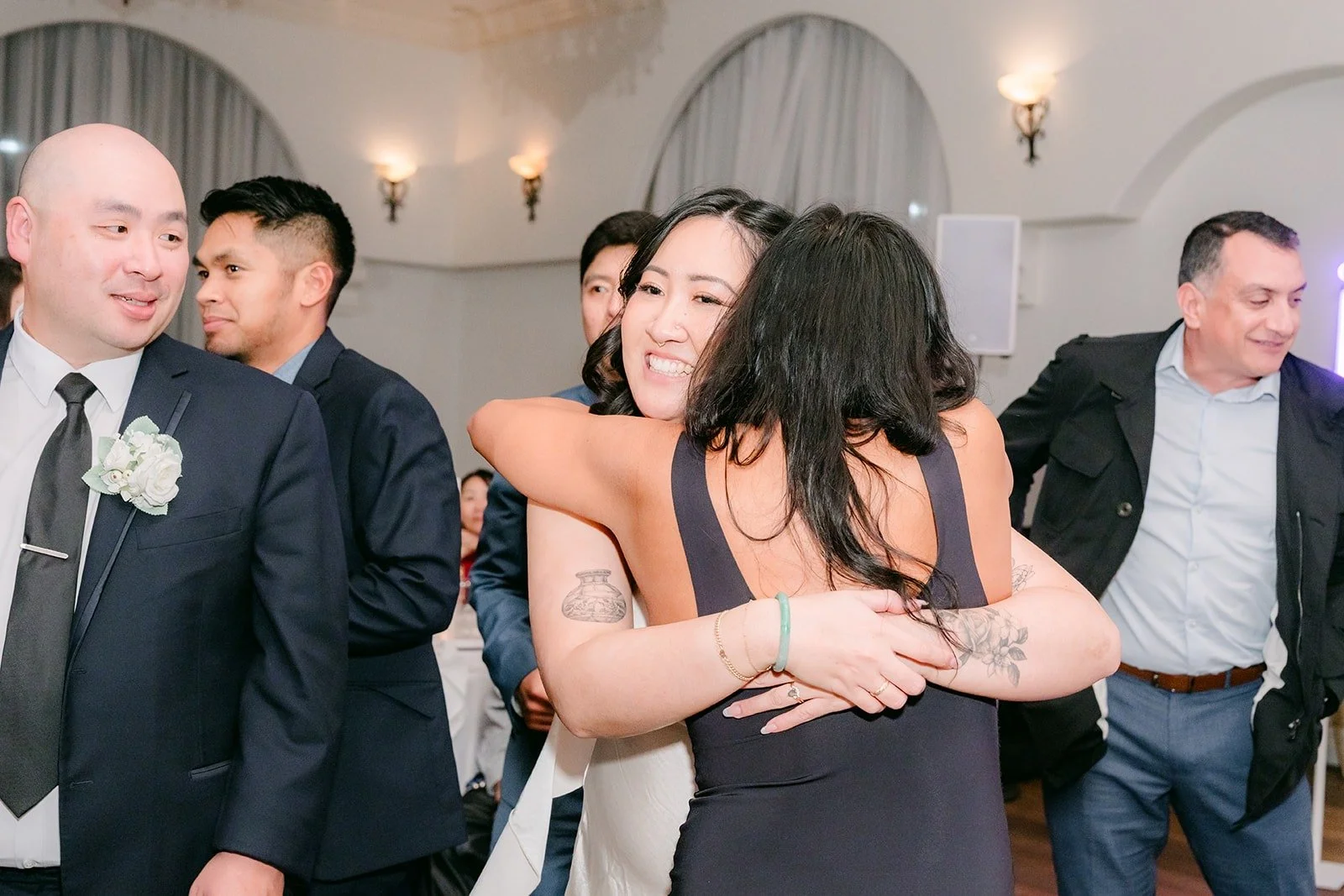 Vivian hugging a guest on the dance floor
