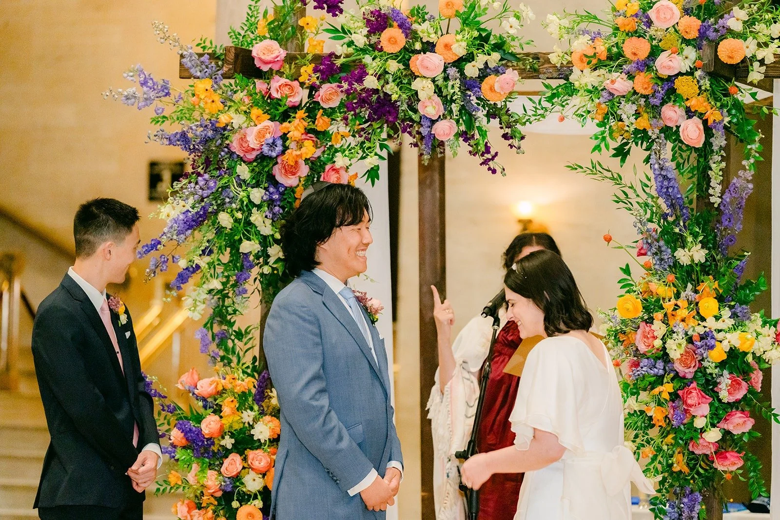 Jessie and Philip facing each other beneath the arch