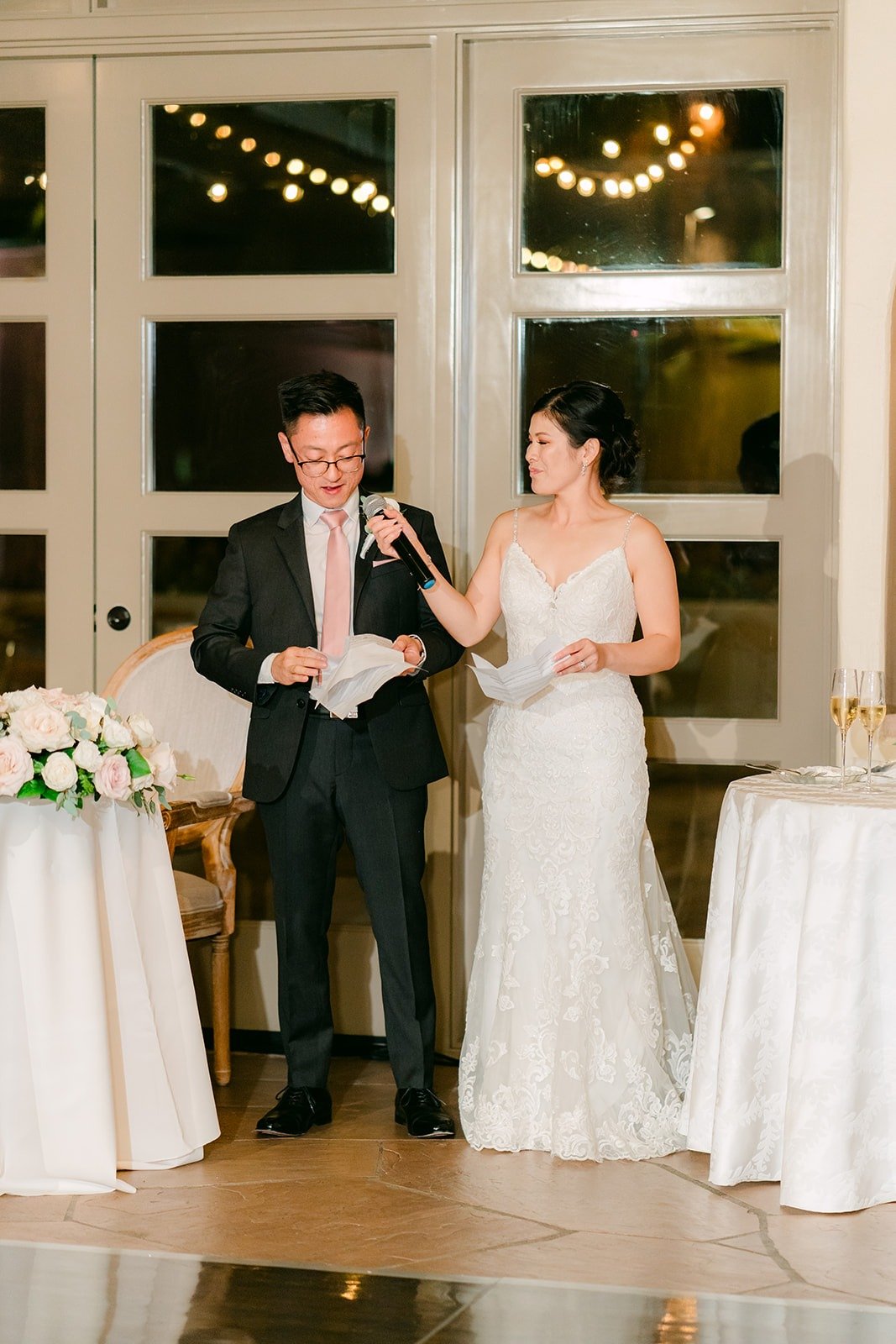 Alex and Xuemin thanking their guests with a microphone