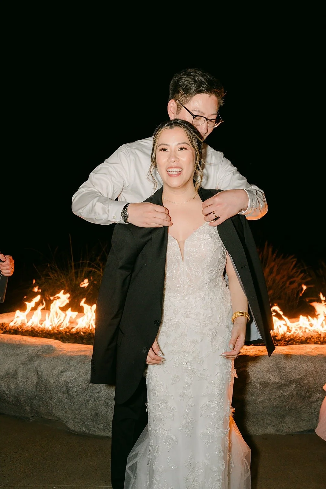 Joanne and Zach by the firepit at night at Kijamii Overlook, photographed by One and Only Production