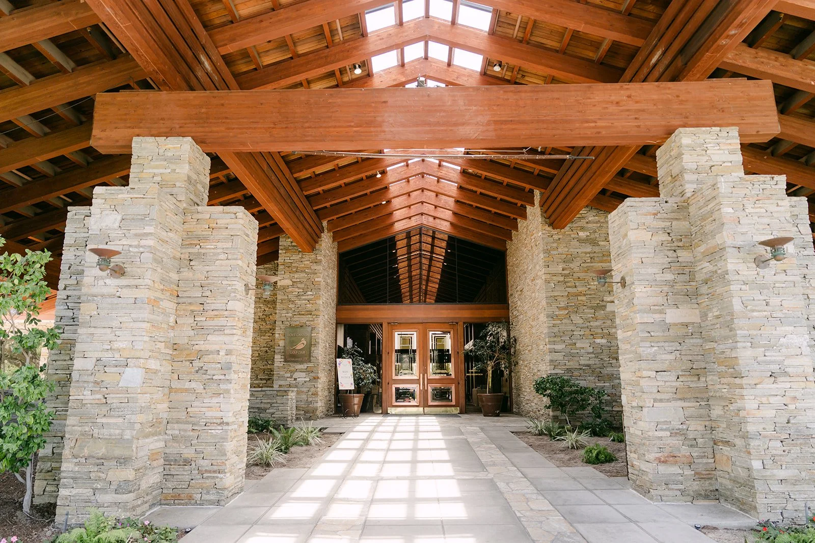 The stone and timber entrance at Dove Canyon by Wedgewood Weddings