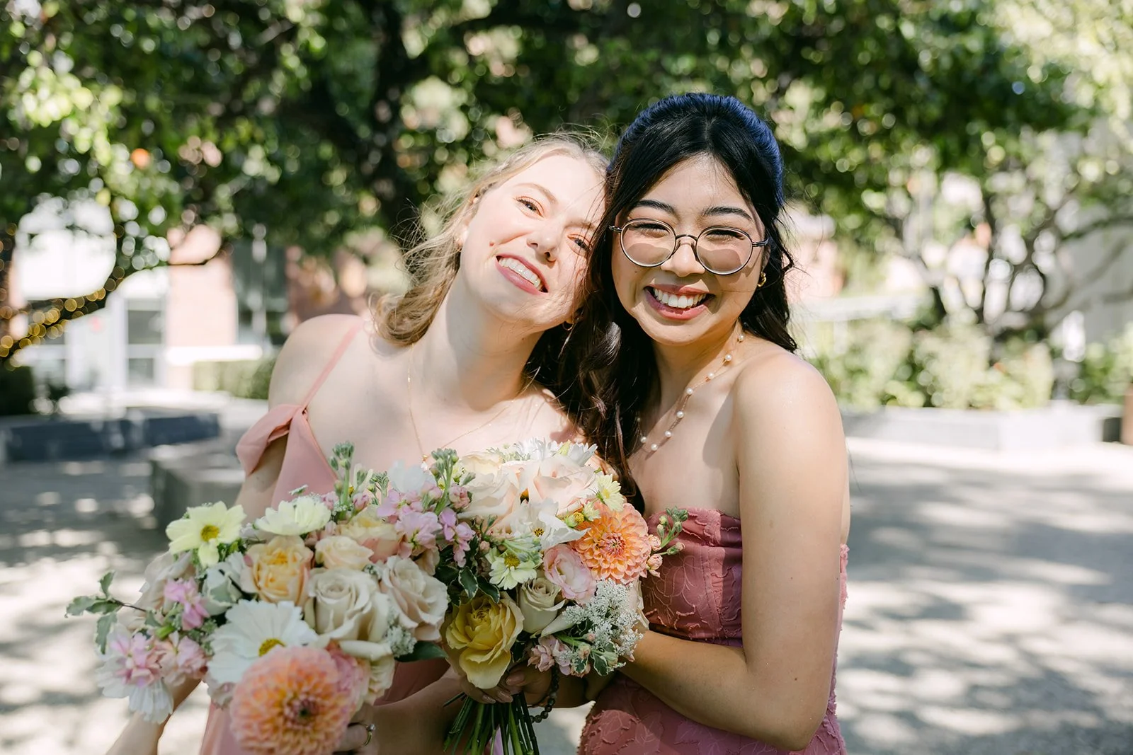 Clarissa laughing with a bridesmaid