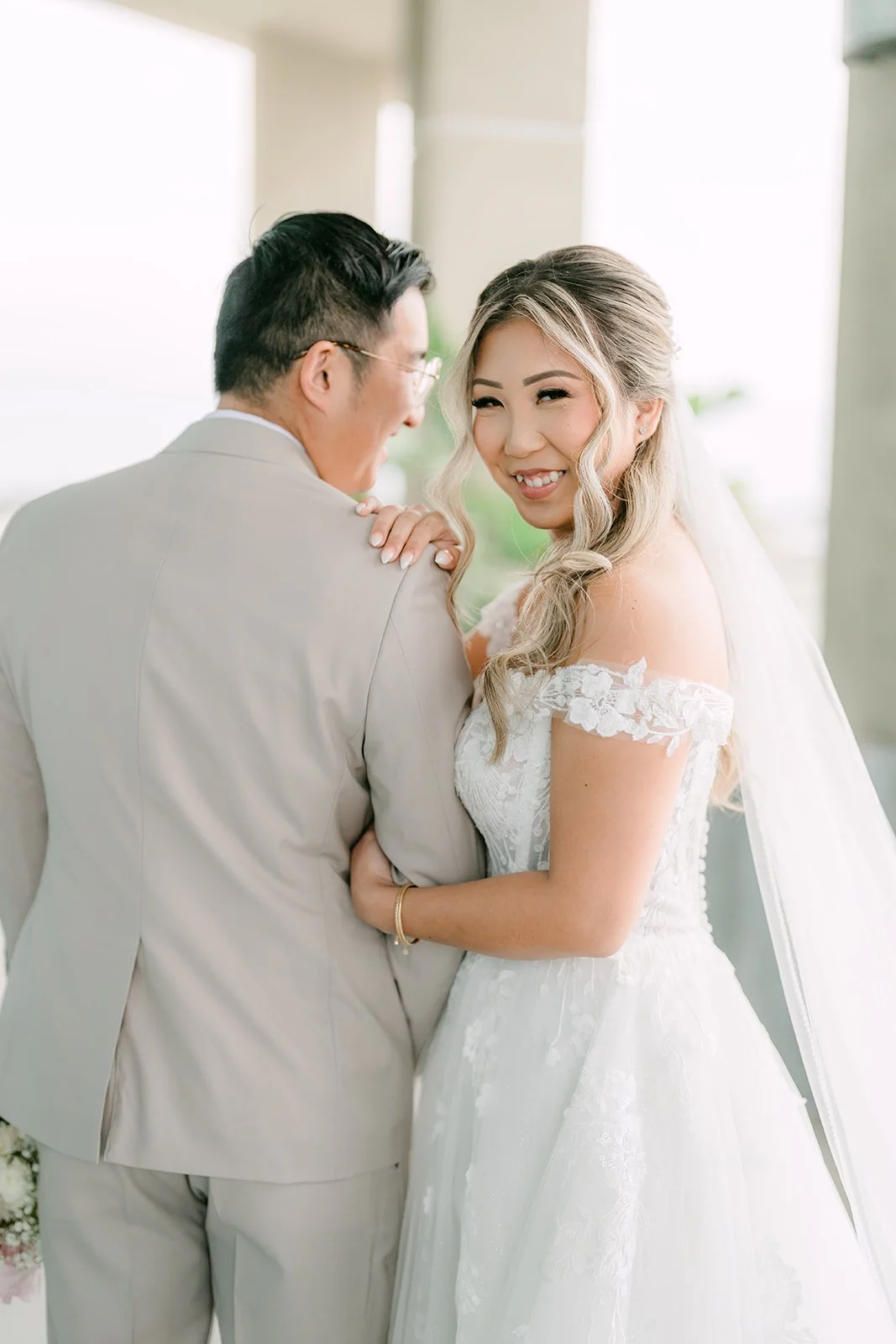 Raine laughing with her hand on Ricky's shoulder after the first look