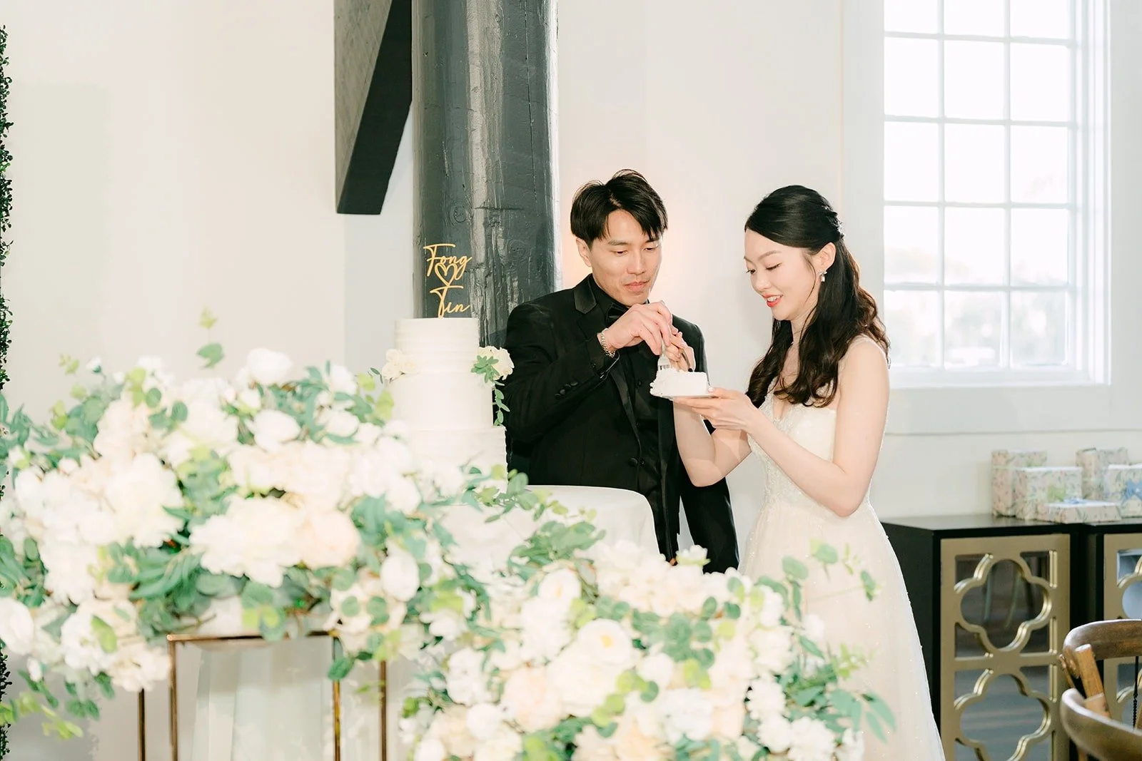 Tin and Fong laughing over the cake, photographed by One and Only Production