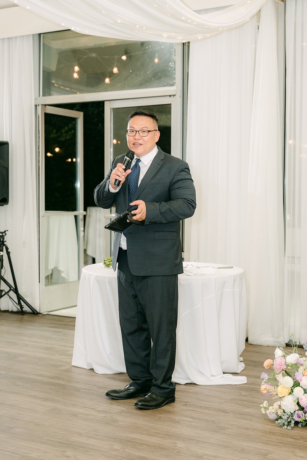 A guest giving a toast with a microphone