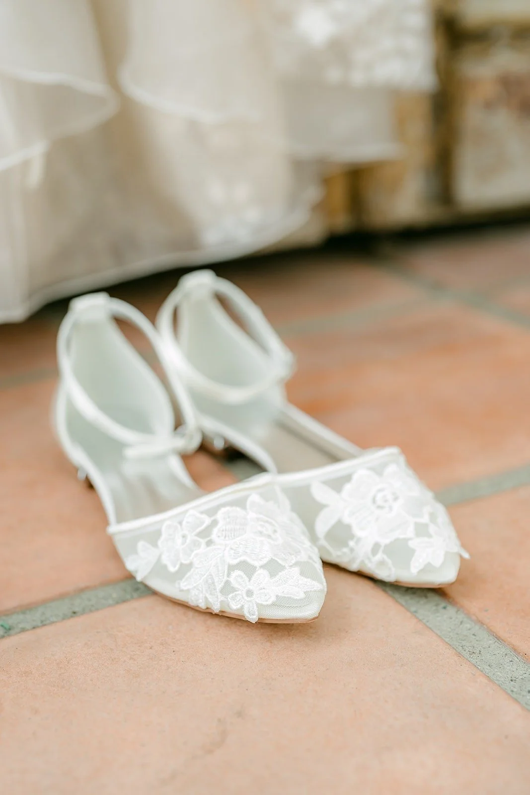 Joanna's lace pointed flats on the terracotta tile