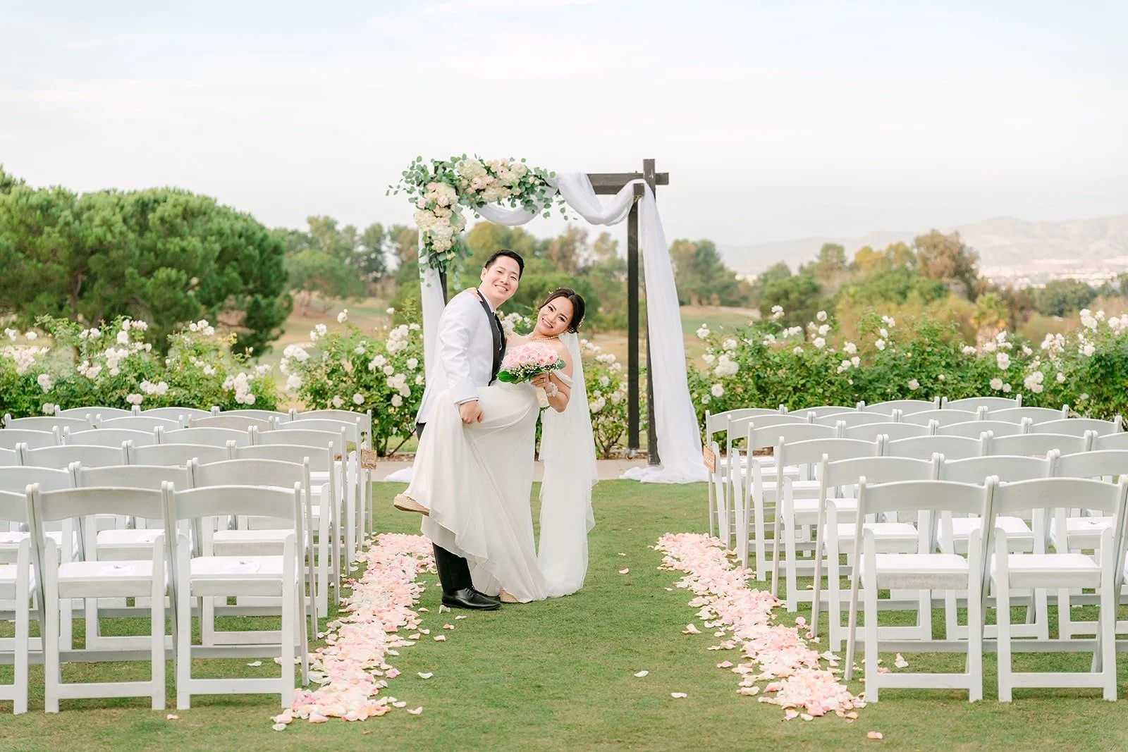 Ivy and Chungman at the empty ceremony site overlooking the golf course, photographed by One and Only Production