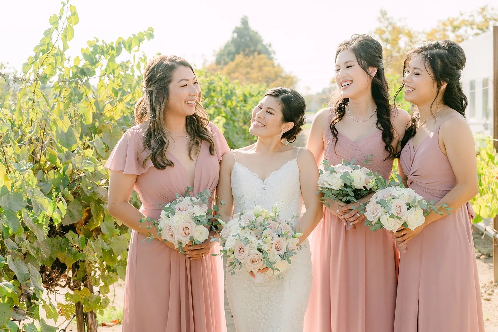 Xuemin and her bridesmaids in blush gowns in the vineyard
