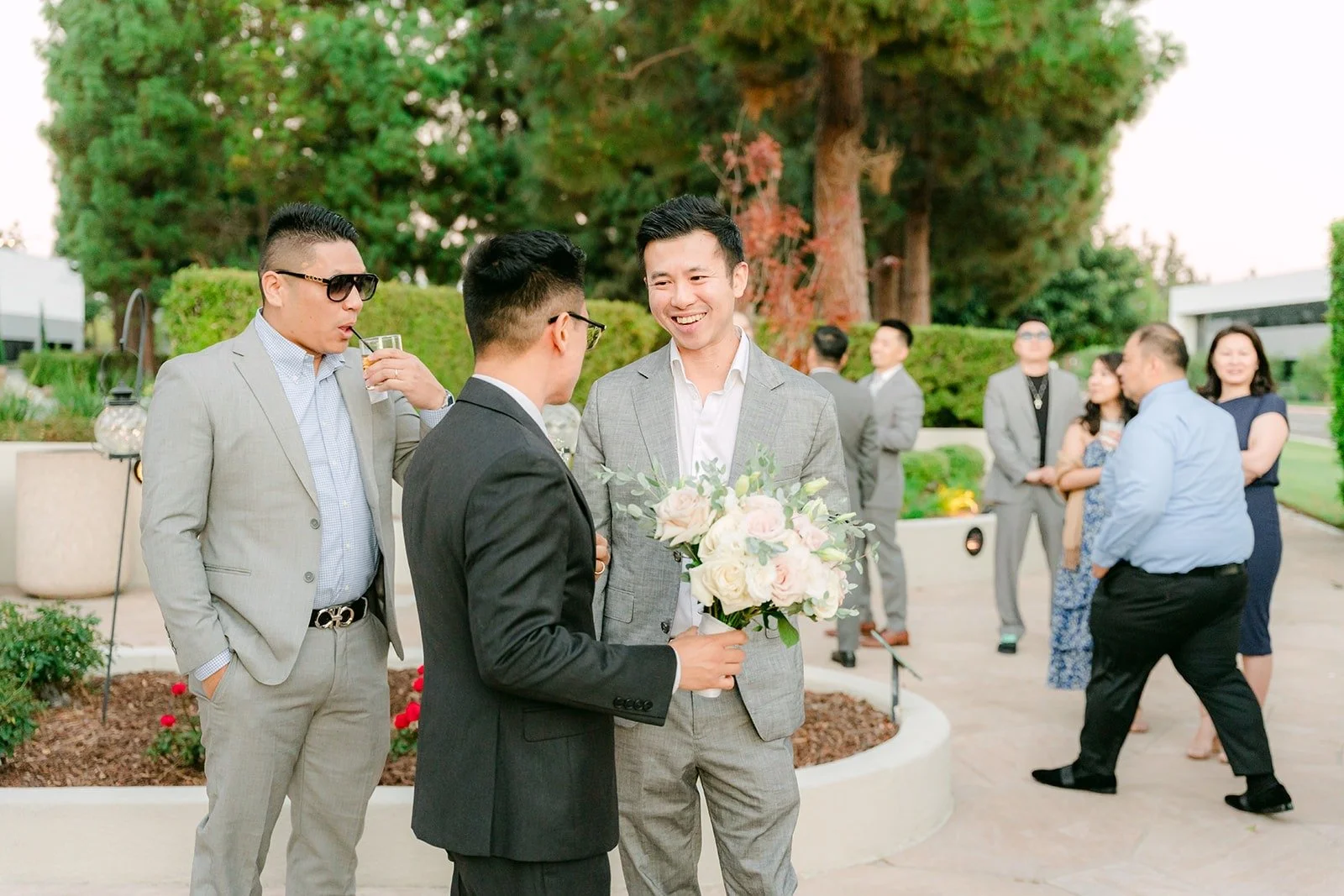 Guests mingling outside during cocktail hour