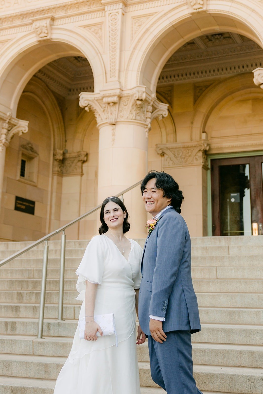 Jessie and Philip close together beneath the museum's arches