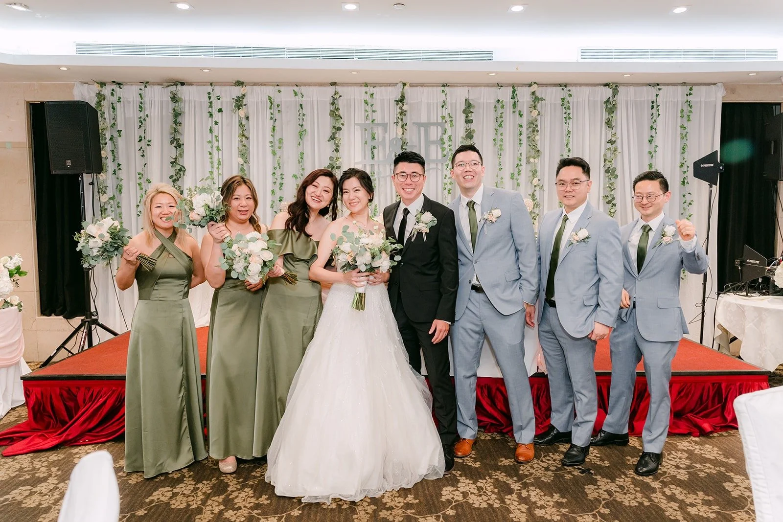 The full wedding party on stage at Five Star Seafood Restaurant