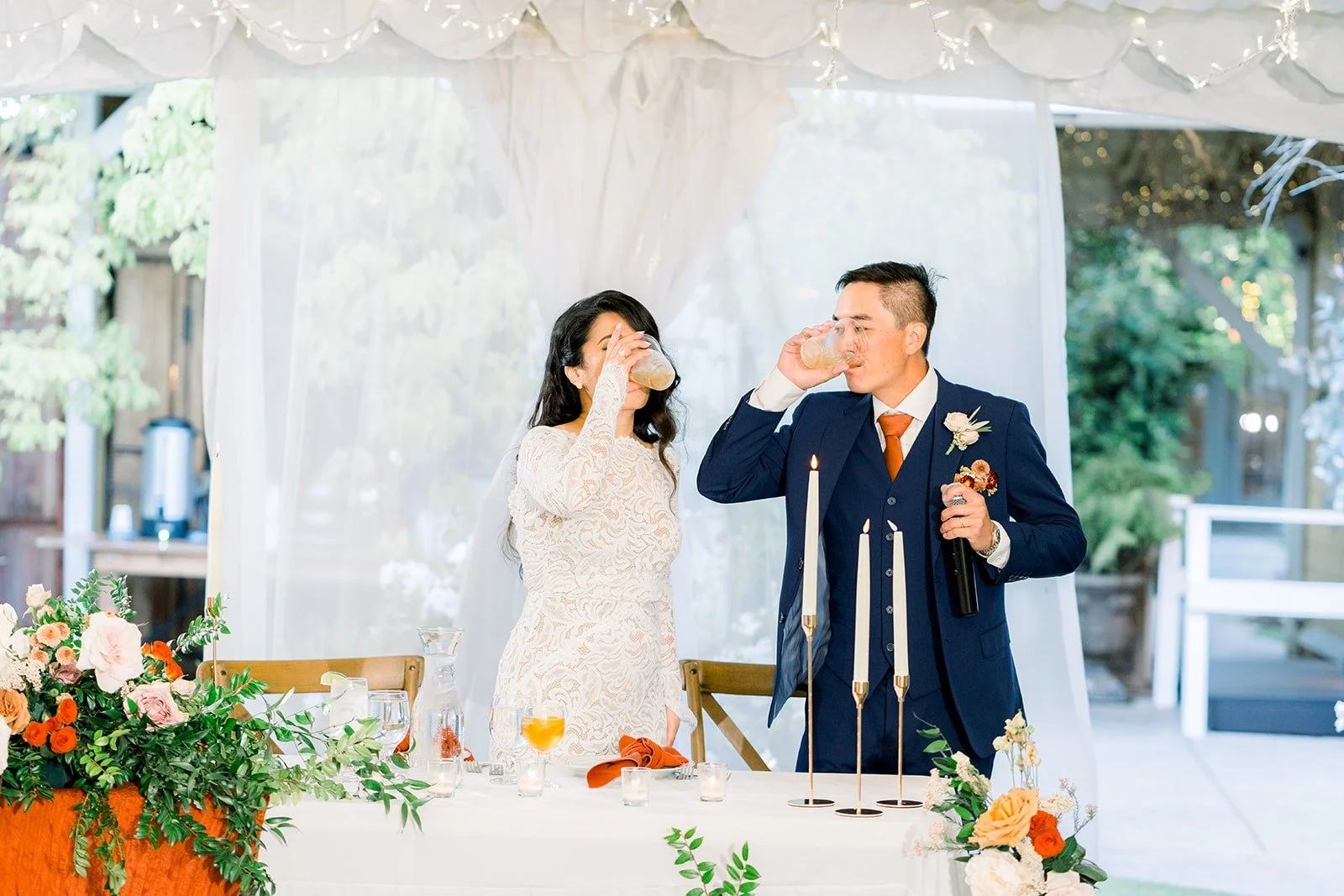 Hannah and Vincent listening to a speech at their table