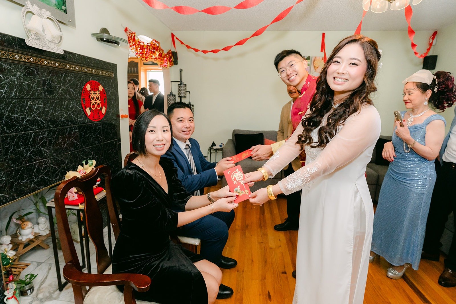 Shayna and Robert pour tea for family members at the tea ceremony