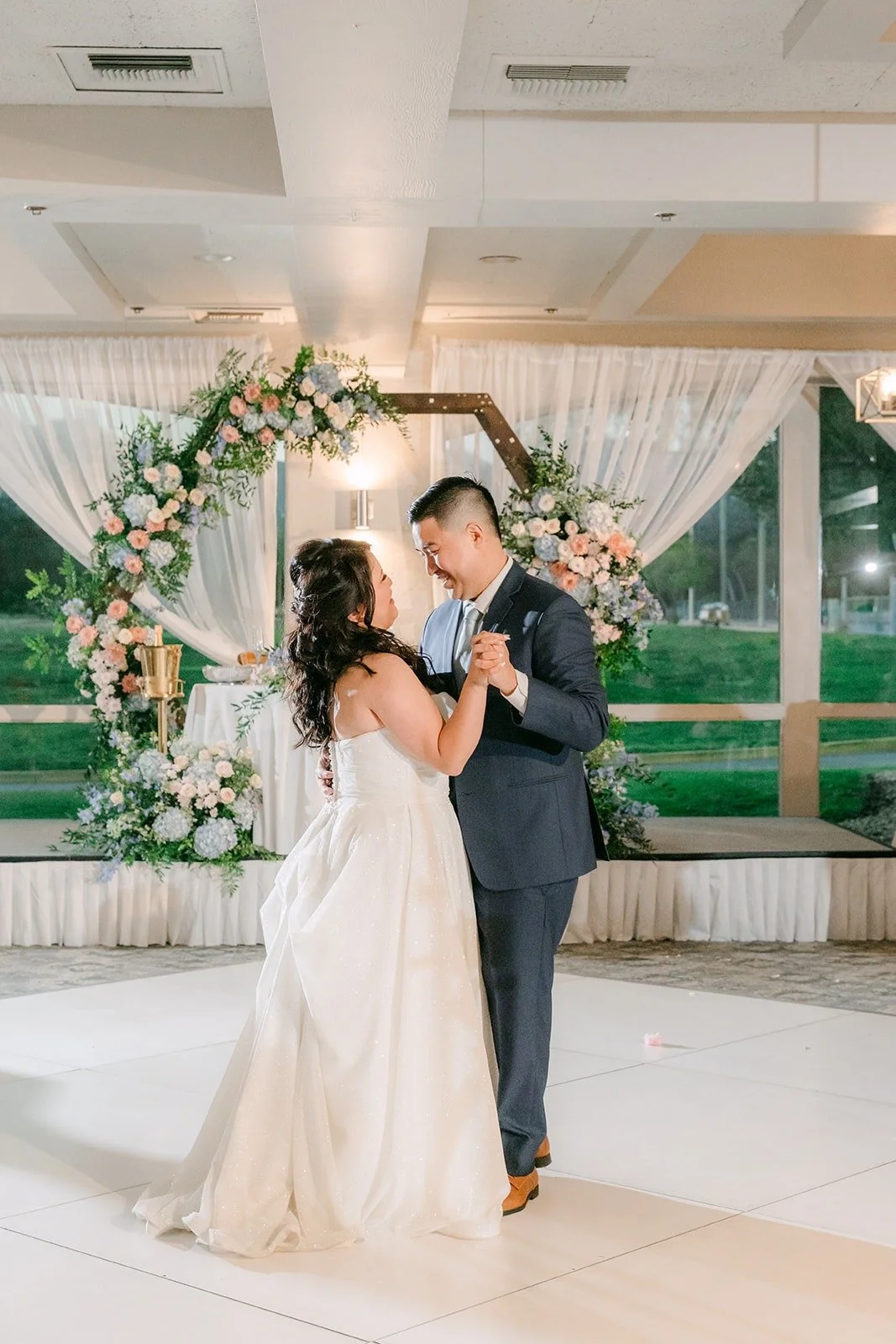 Florence and Jordan's first dance under the floral arch