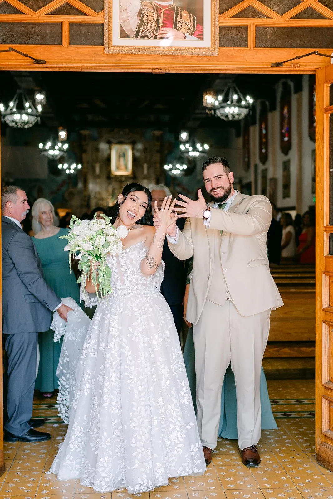 Fernanda and Cody celebrating with family after the ceremony, photographed by One and Only Production.