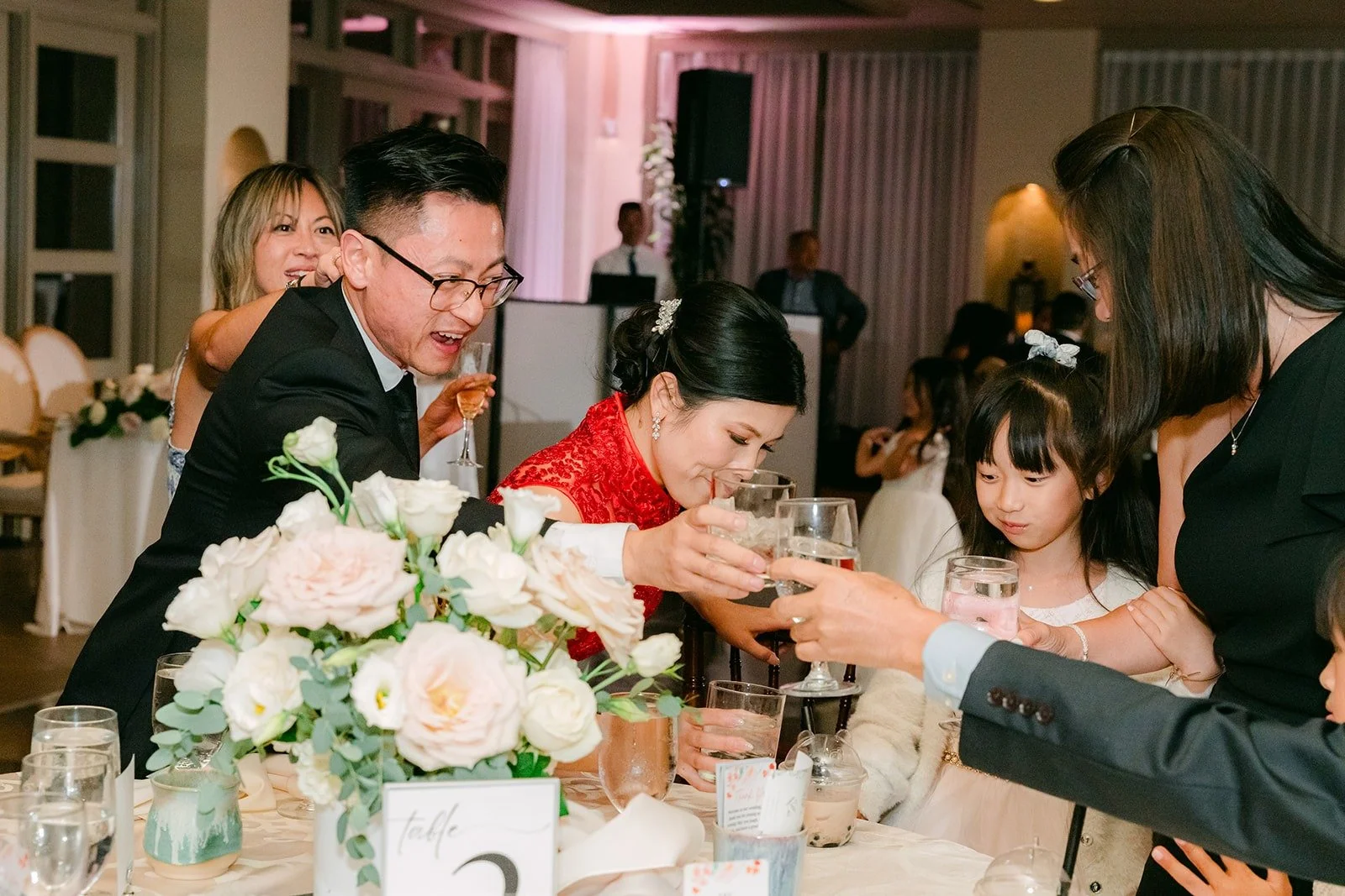 Xuemin and Alex visiting tables with guests