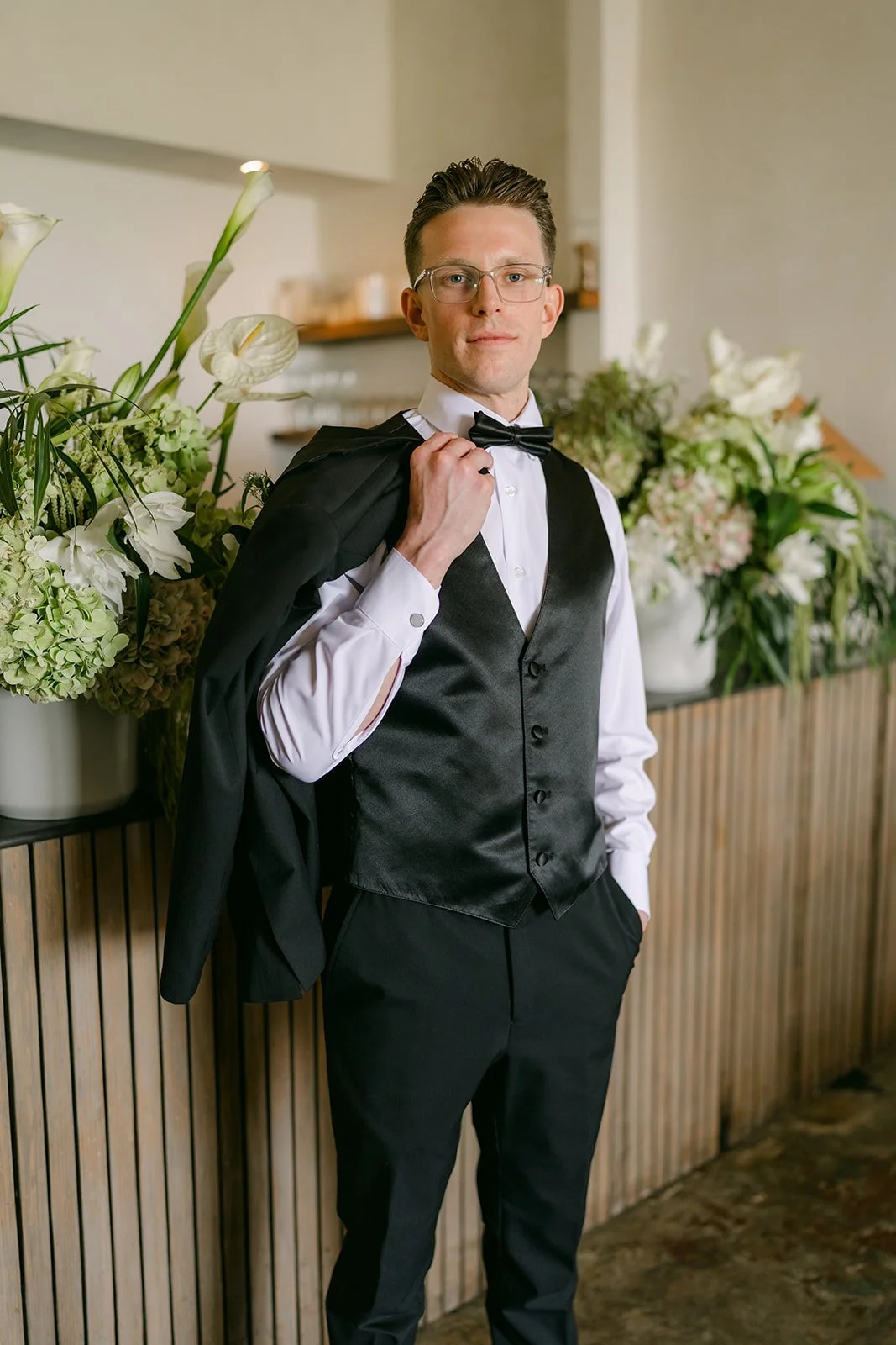 Matthew with his jacket over his shoulder