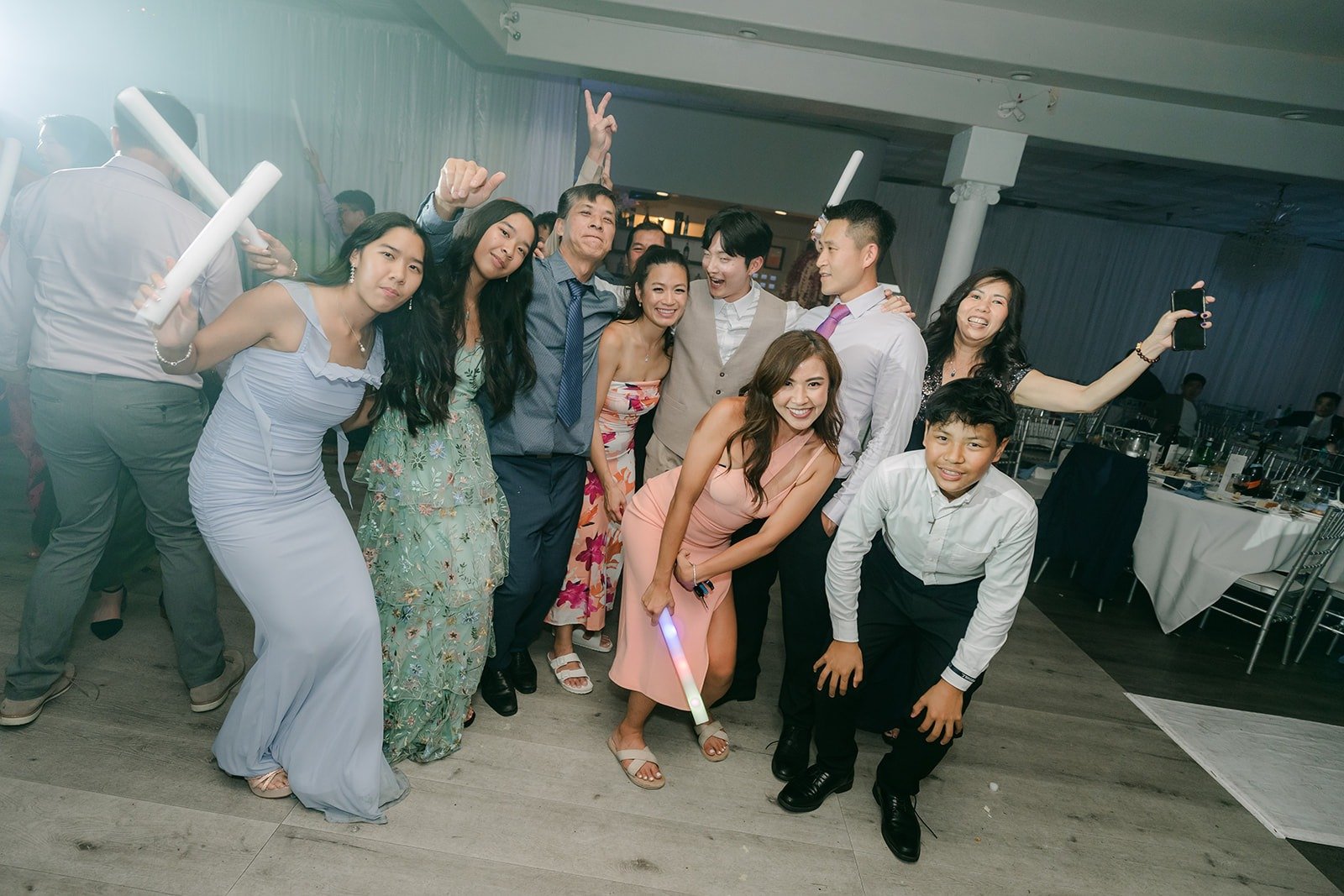 Guests throwing their hands up on the dance floor