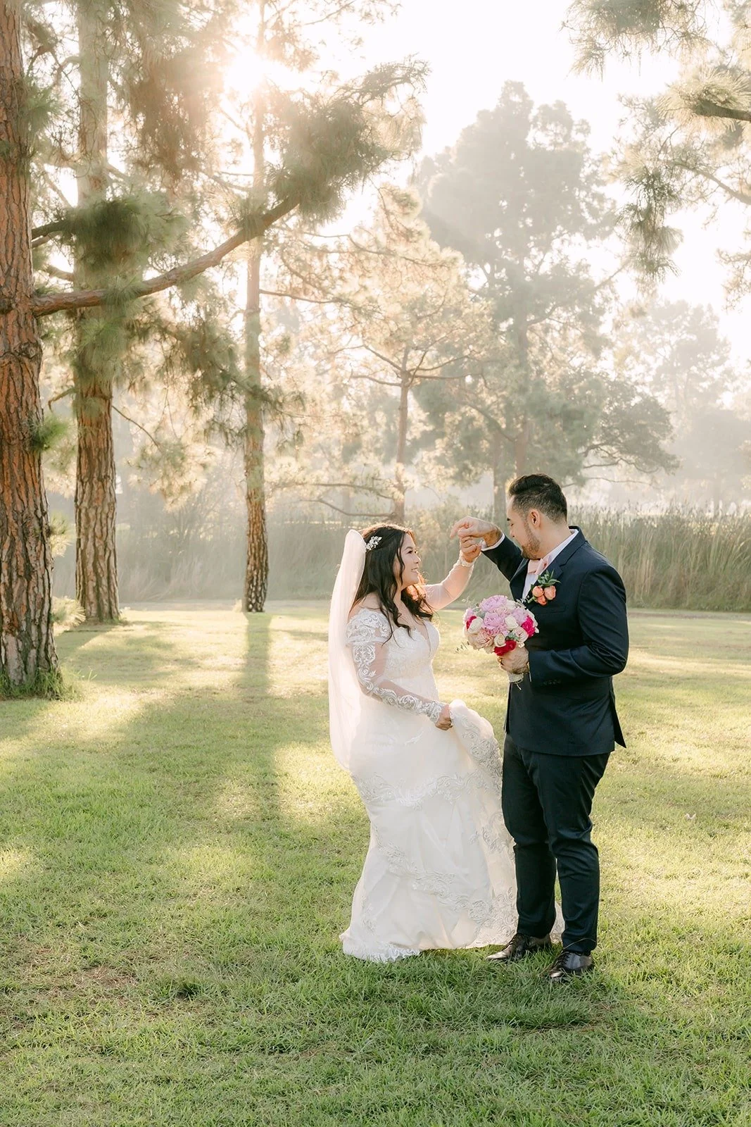 Amy and James sharing a quiet moment on the lawn, photographed by One and Only Production