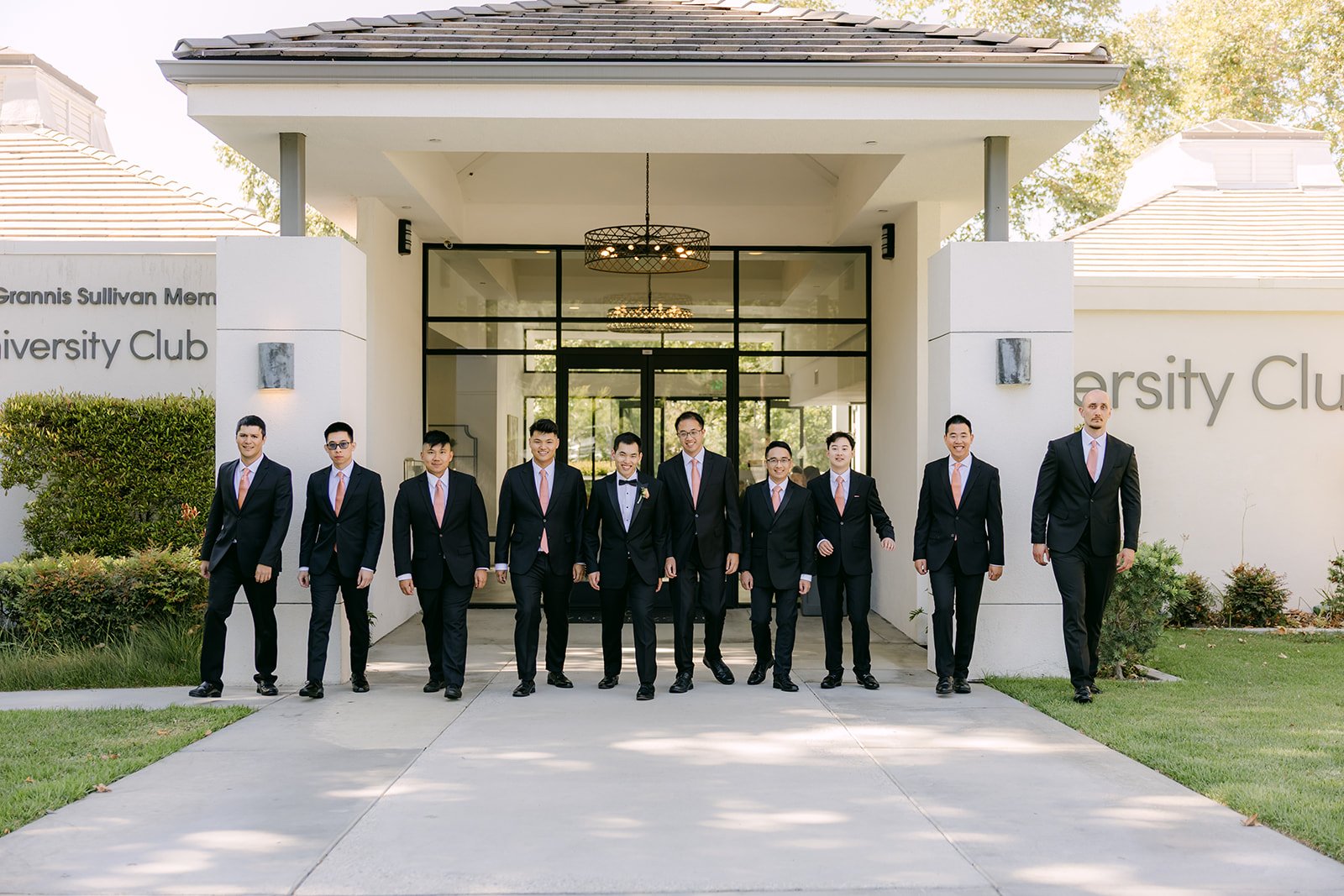 Austin and his groomsmen at the entrance of the University Club