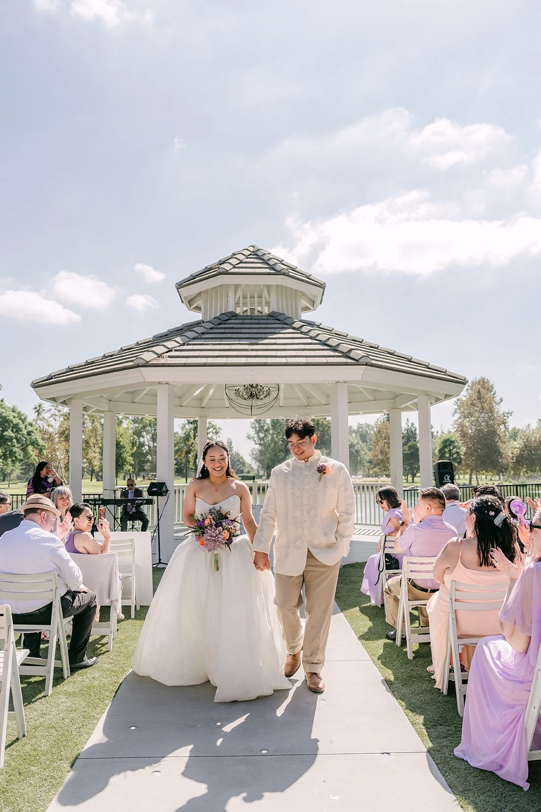 Angela and Jacob walking back up the aisle