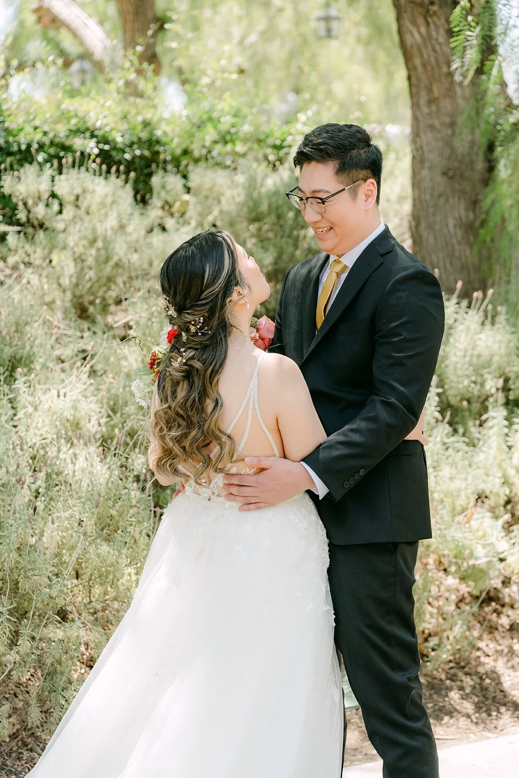 Joanne and Zach holding each other after the first look