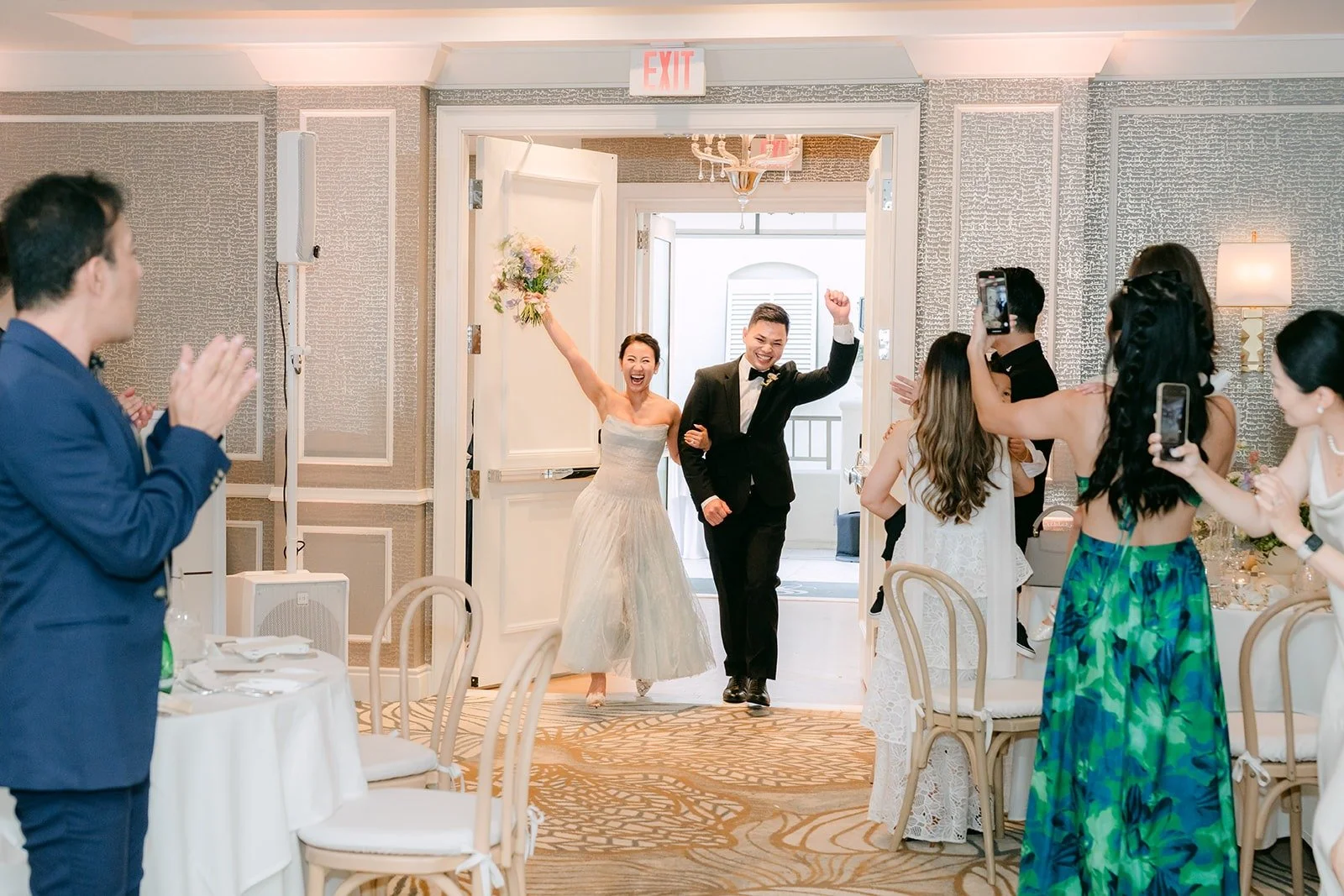 Mario making his entrance into the ballroom with his arm raised