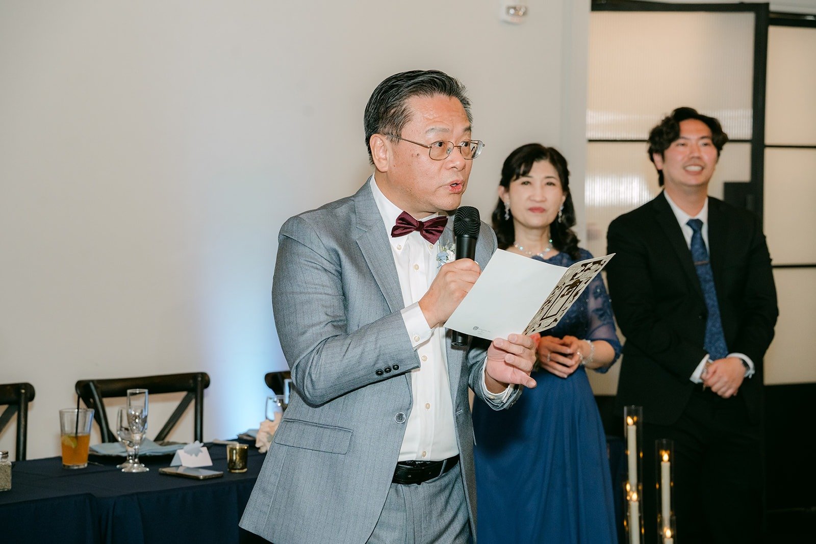 A family member gives a speech at the reception