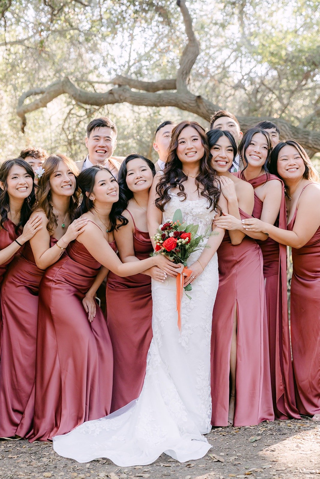 Shayna surrounded by her bridesmaids under the oaks