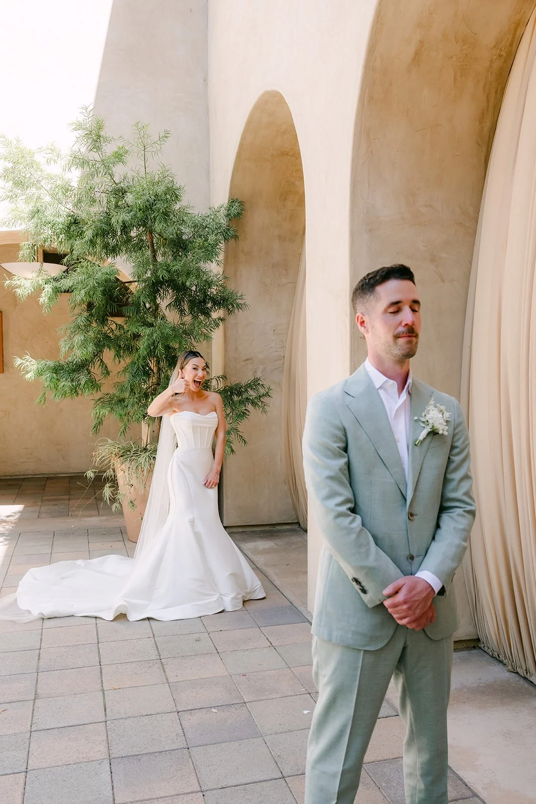 First look as Kieu walks up behind Anthony in the Serra Plaza courtyard