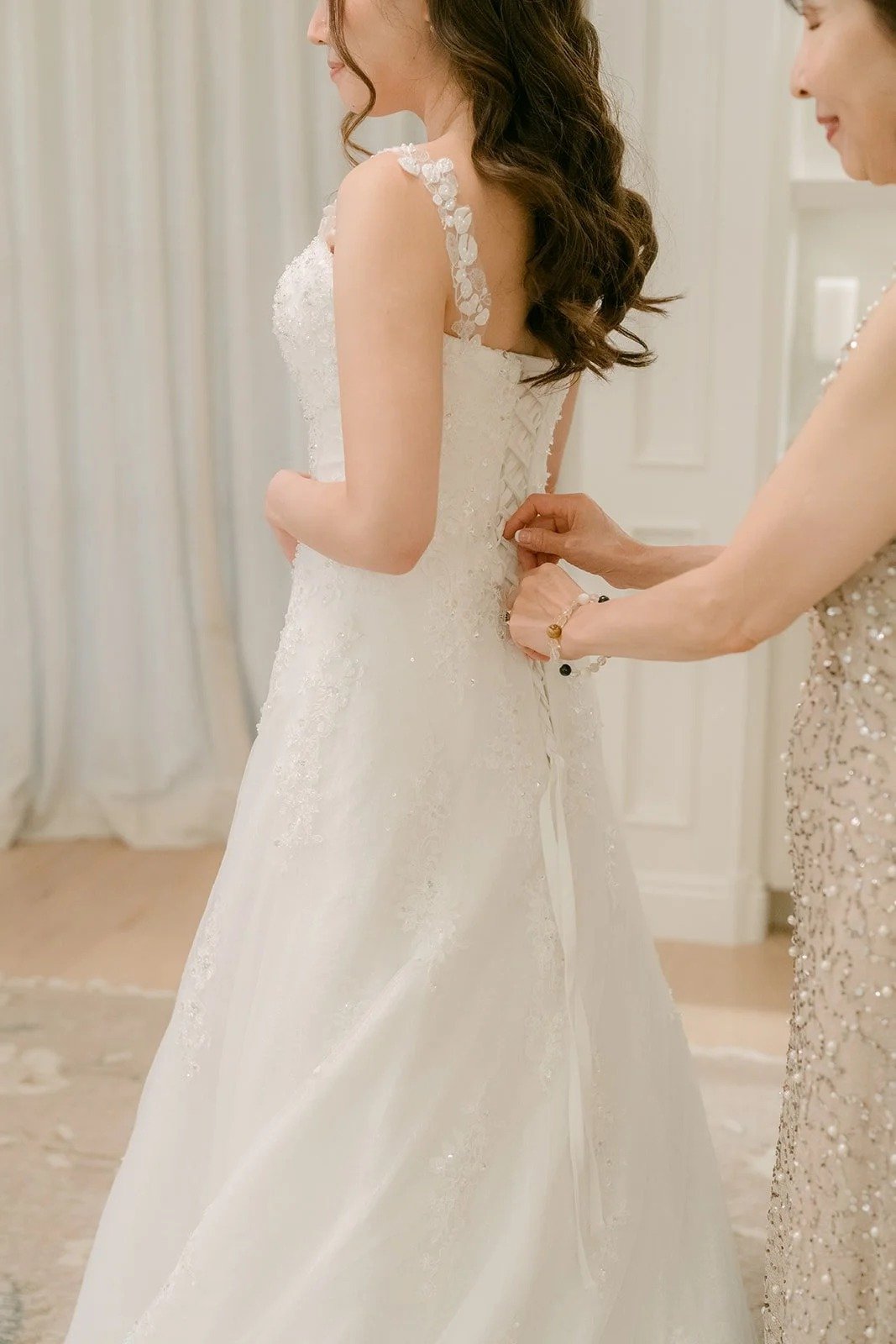 Close up of the gown's back being laced up