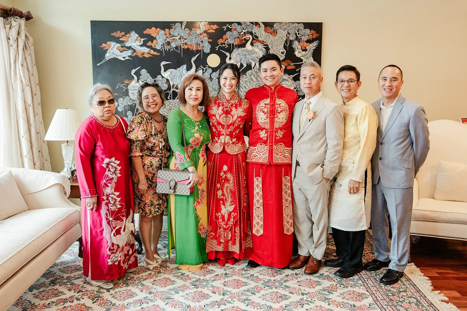 A large family photo with the couple in the living room.