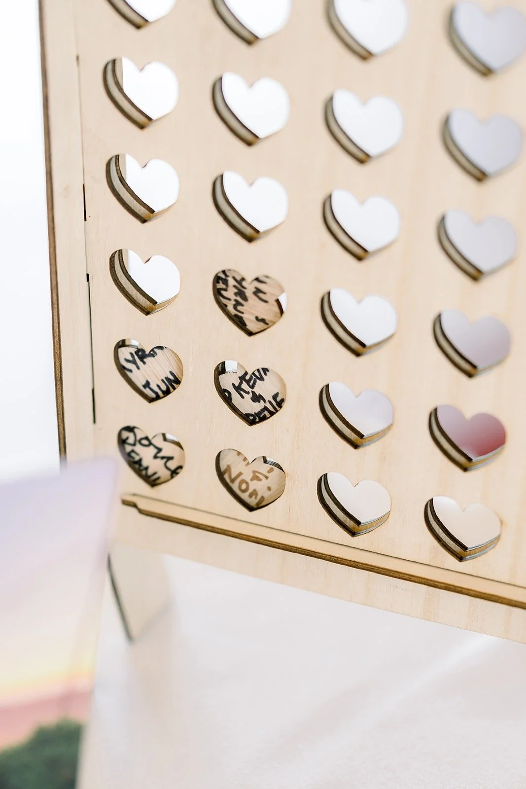 A wall of wooden hearts for guests