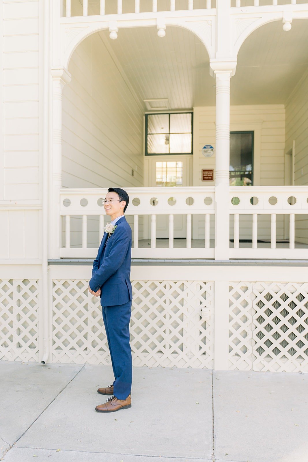 Alex waiting on the white porch of Camarillo Ranch House