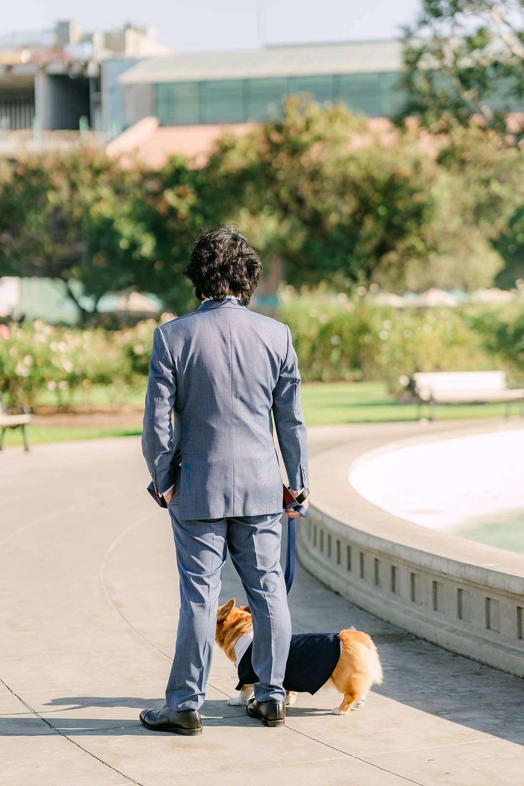 Philip waiting by the fountain with Pumpkin before the first look