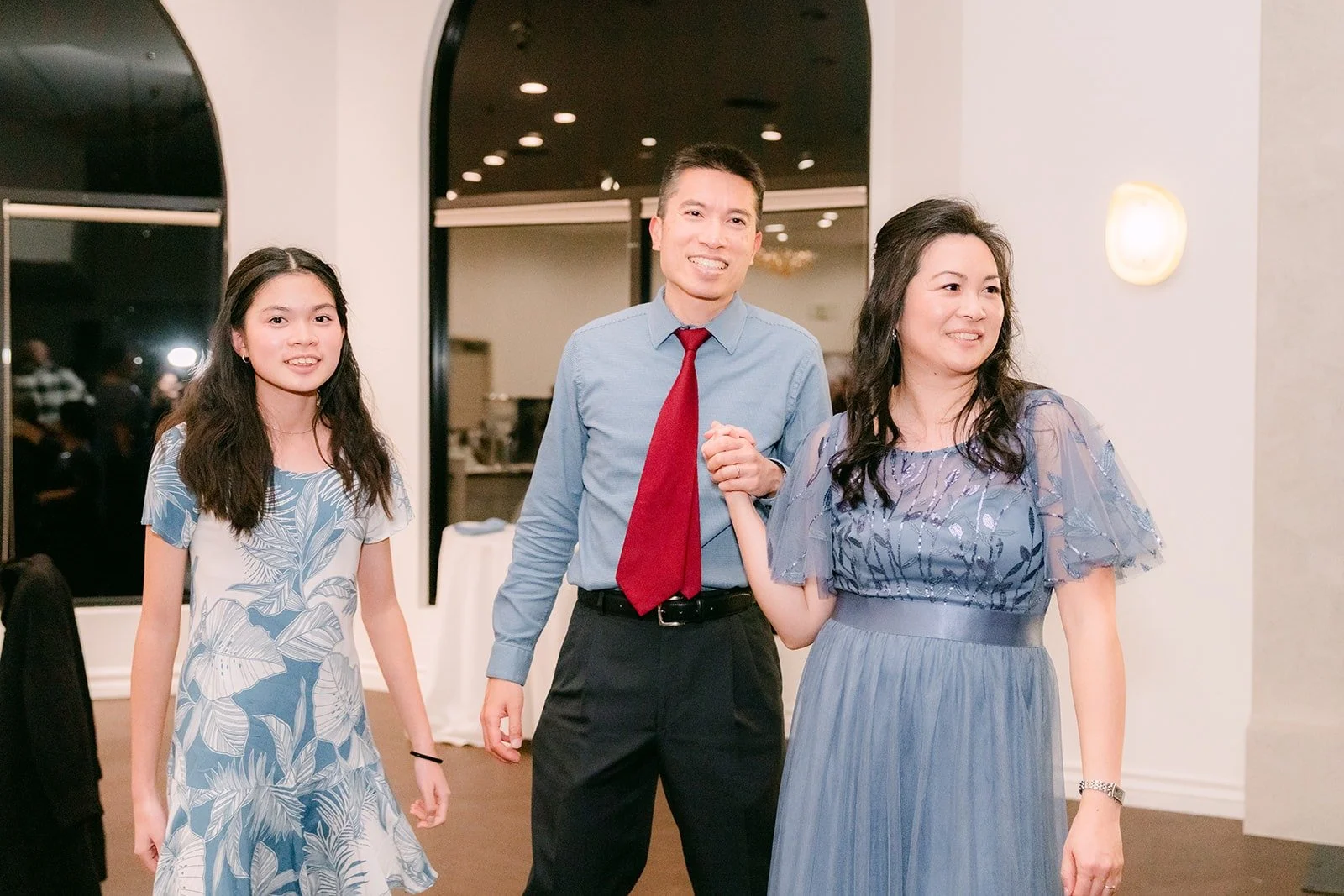 Guests dance together in the reception room