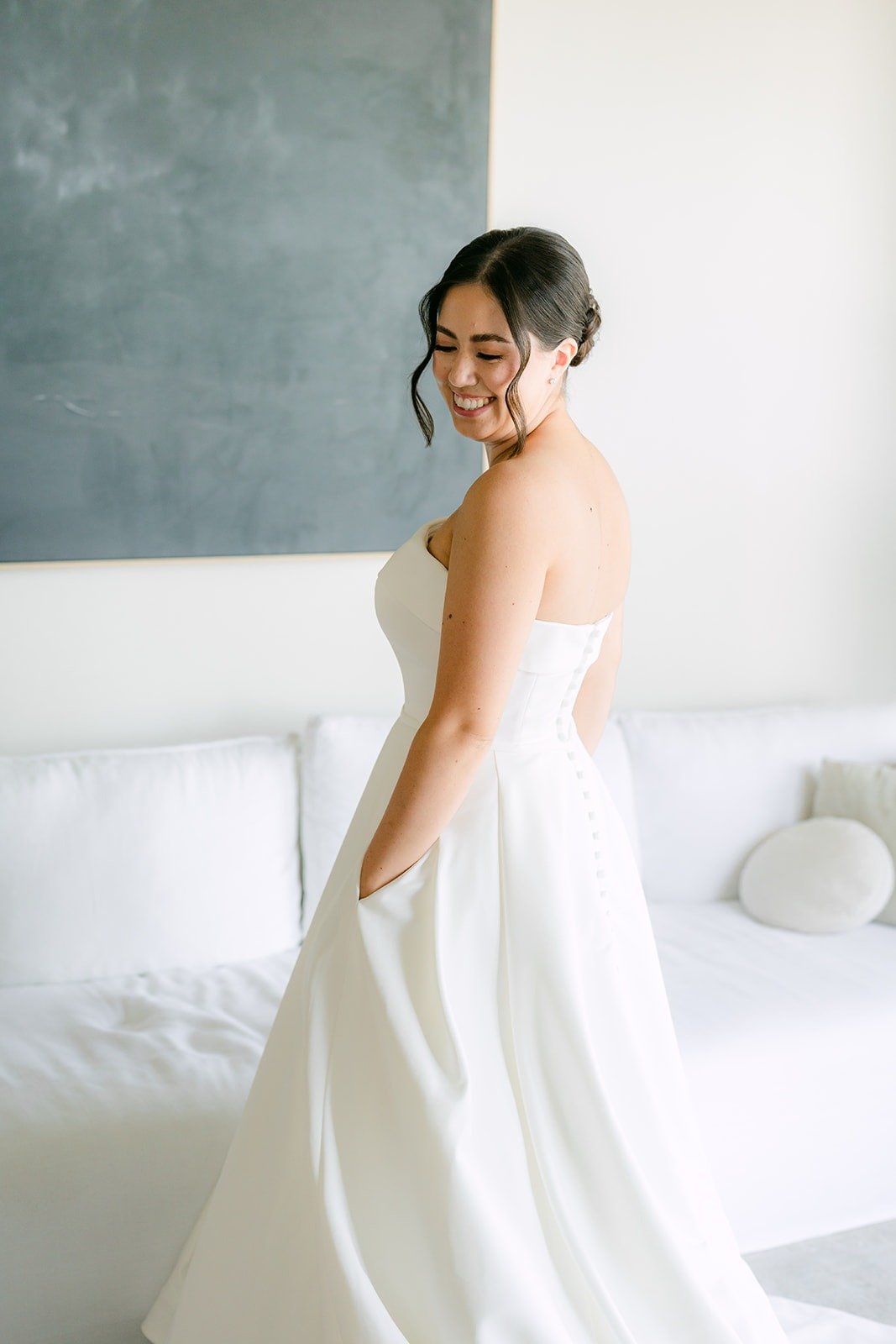 Brianna looking over her shoulder in her satin gown