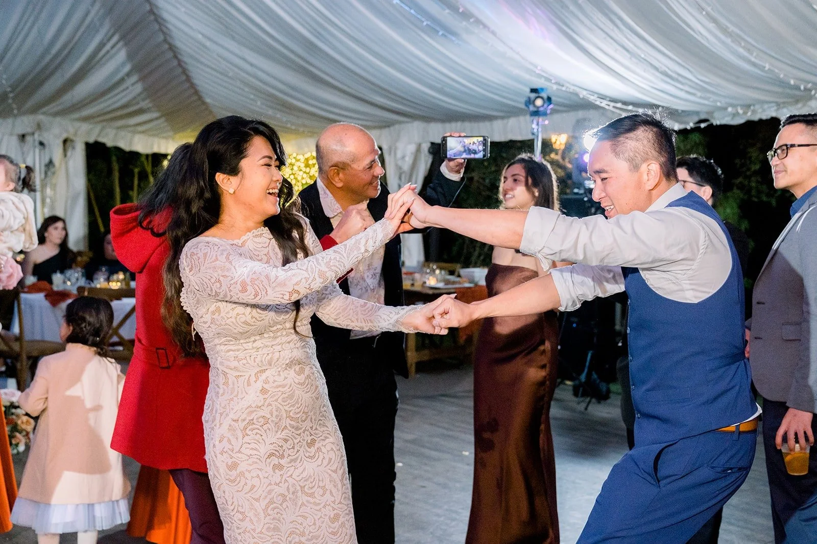 Hannah dancing with guests on the packed floor