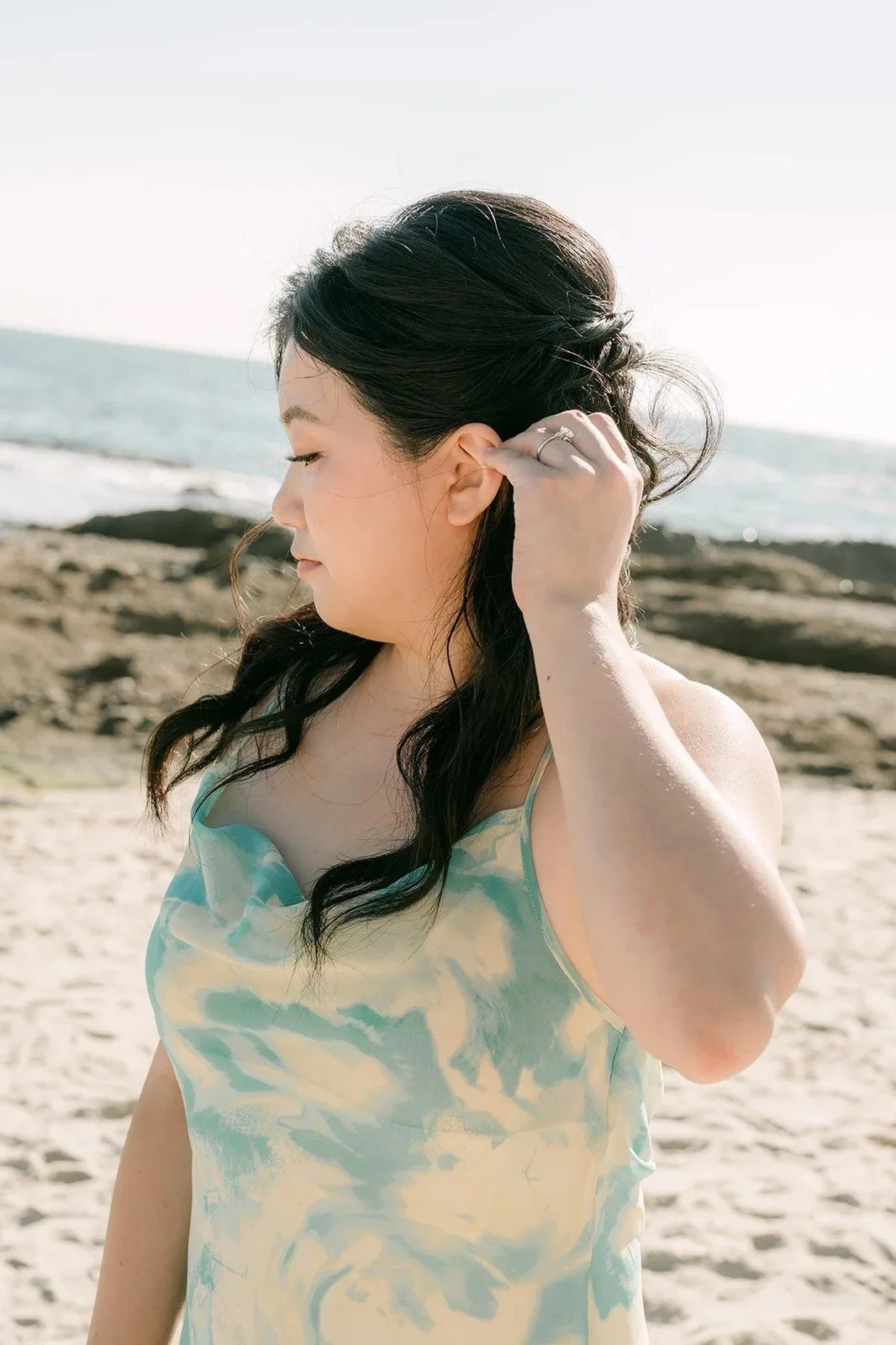 Constance in her floral dress on the beach at Treasure Island.