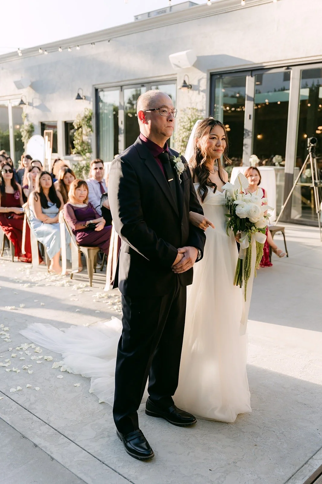 Jadee walking down the aisle with a family member