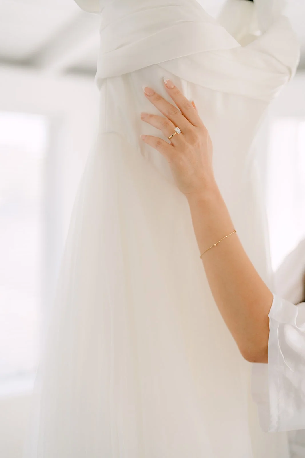 Close up of Jadee touching her gown