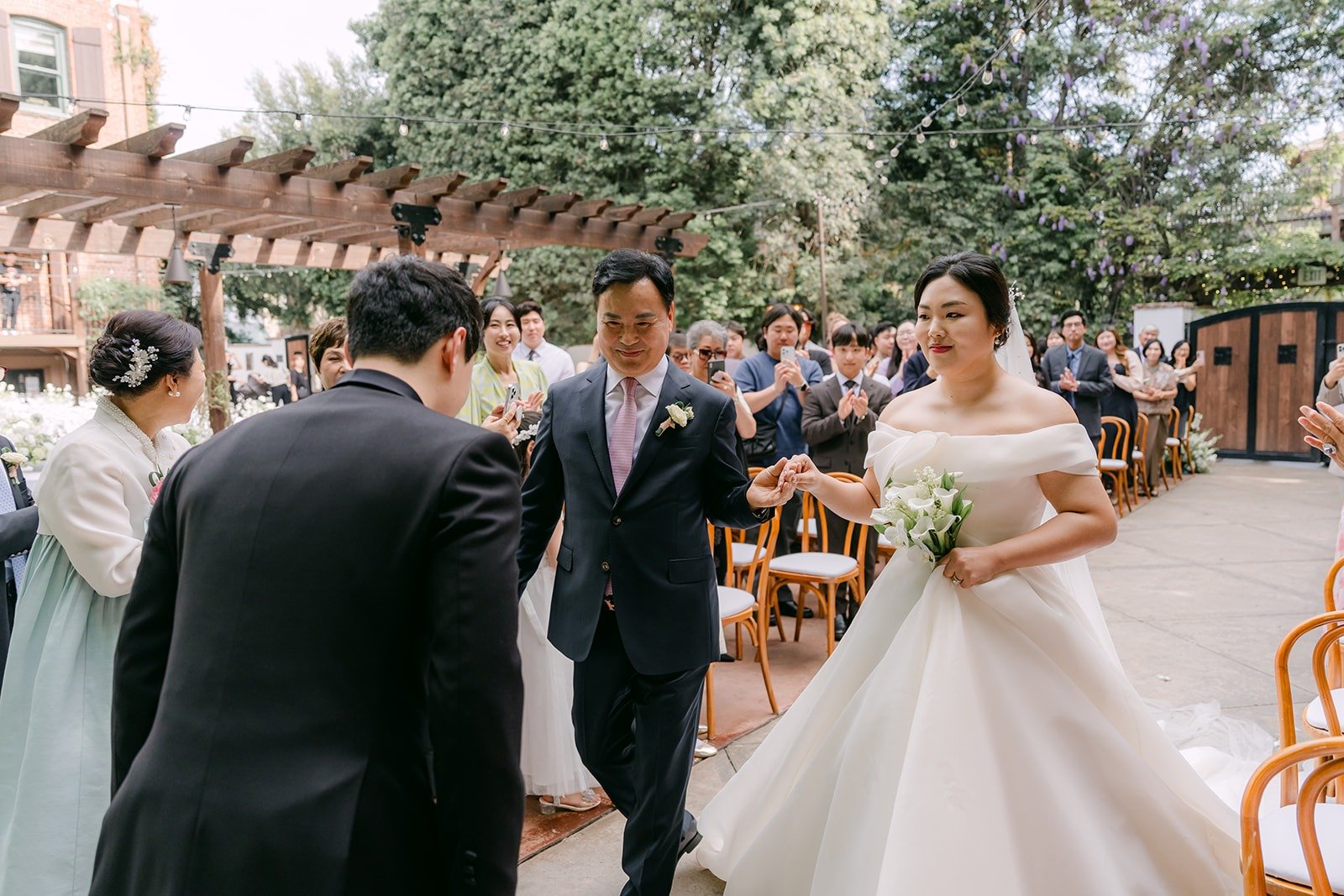Chorok being handed to Min Soo at the end of the aisle