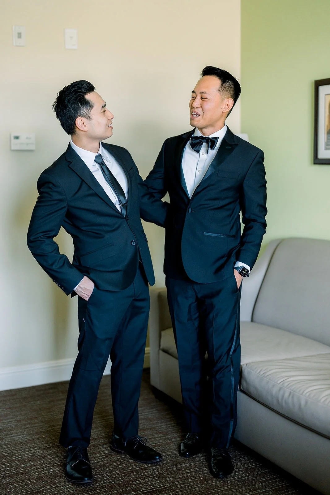 Ralph and a groomsman laughing together in the suite