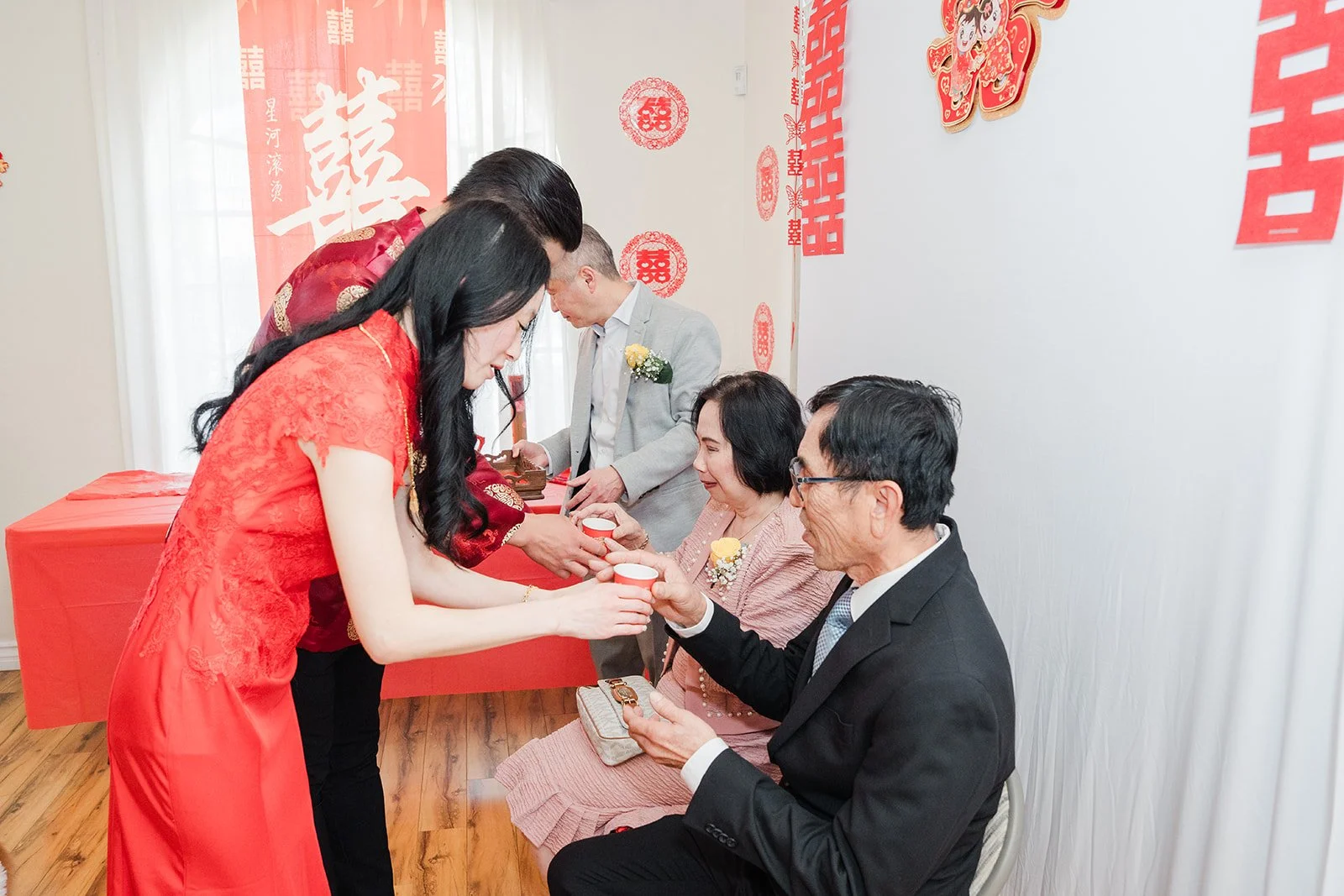 The couple serving tea to an uncle.