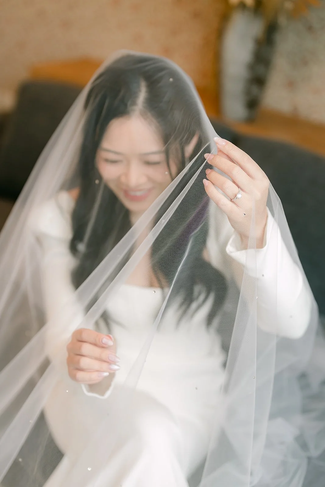 Denise smiling under her cathedral veil.