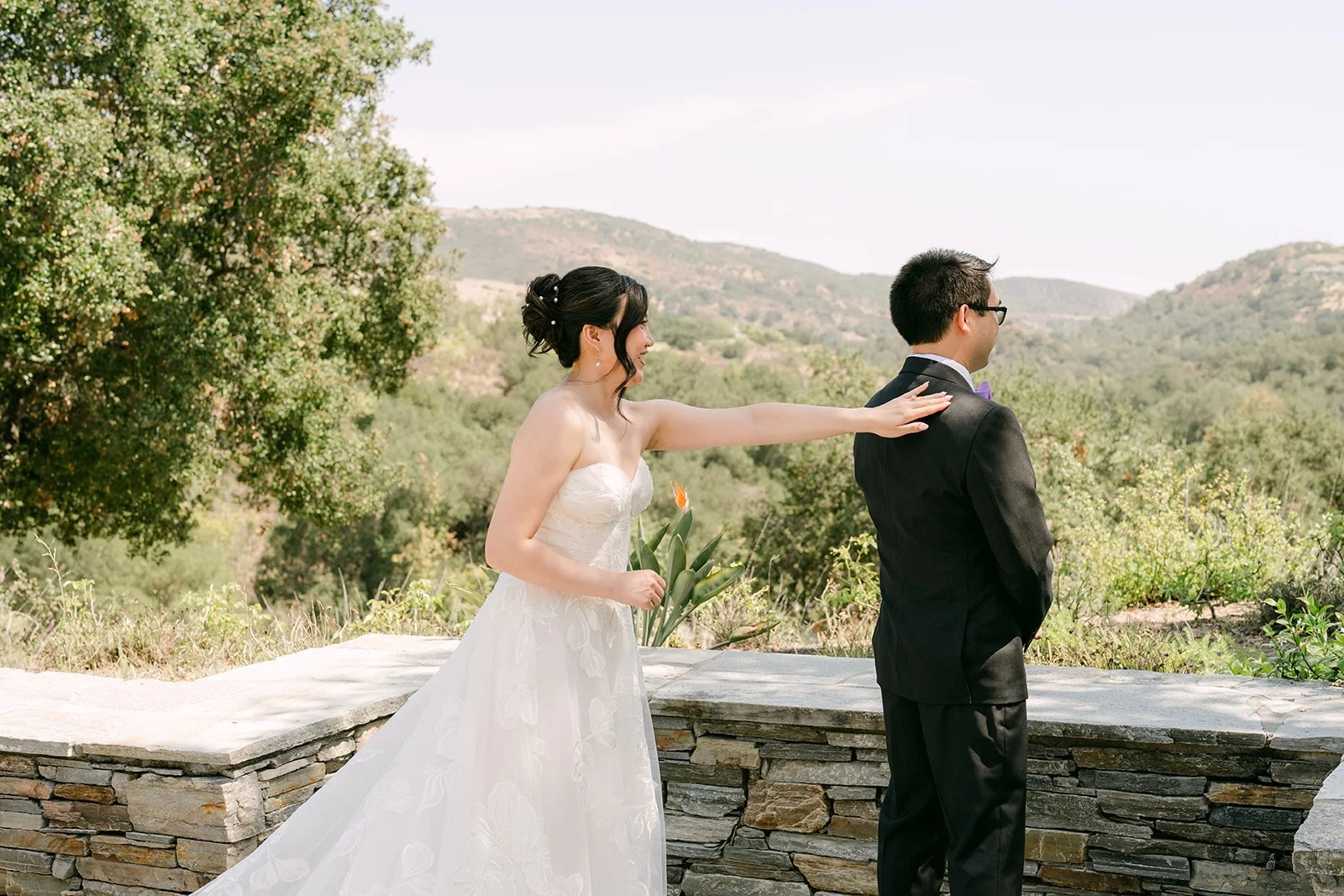 Mary tapping Patrick's shoulder for the first look