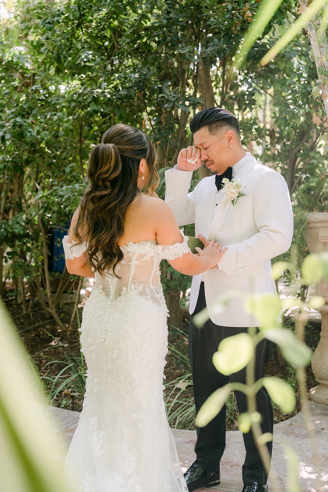 Caryl and Nicole sharing private vows in the garden before the ceremony.
