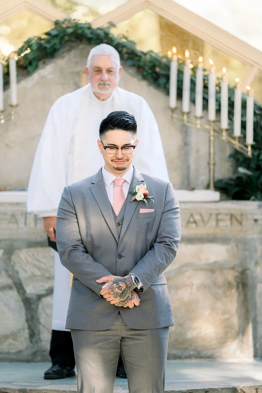 Mikey waits at the altar in front of the officiant