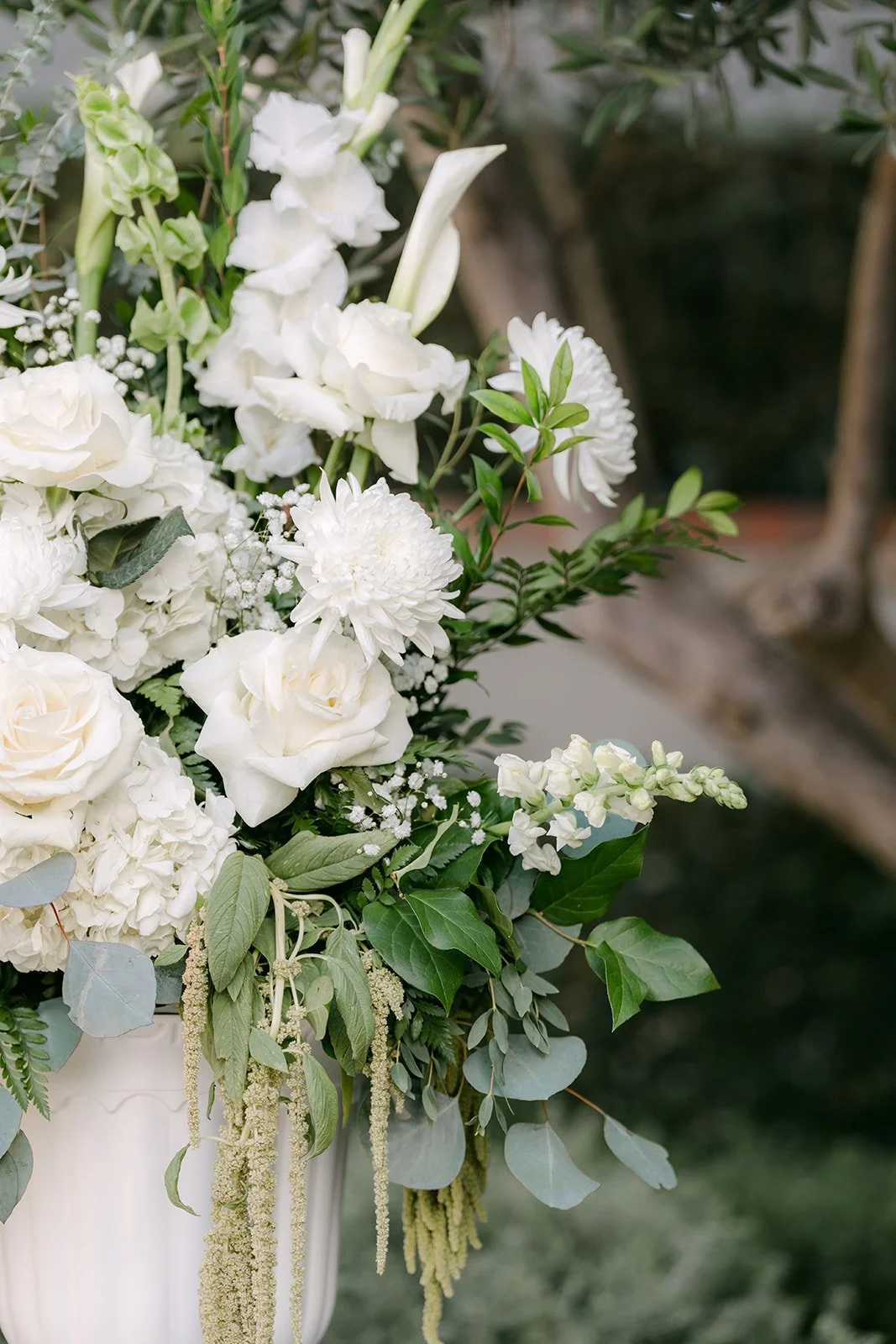 White roses and greenery ceremony florals, photographed by One and Only Production